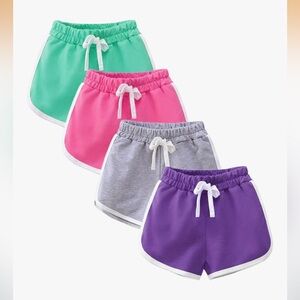 Four pack of dolphin hem cotton athletic shorts for girls